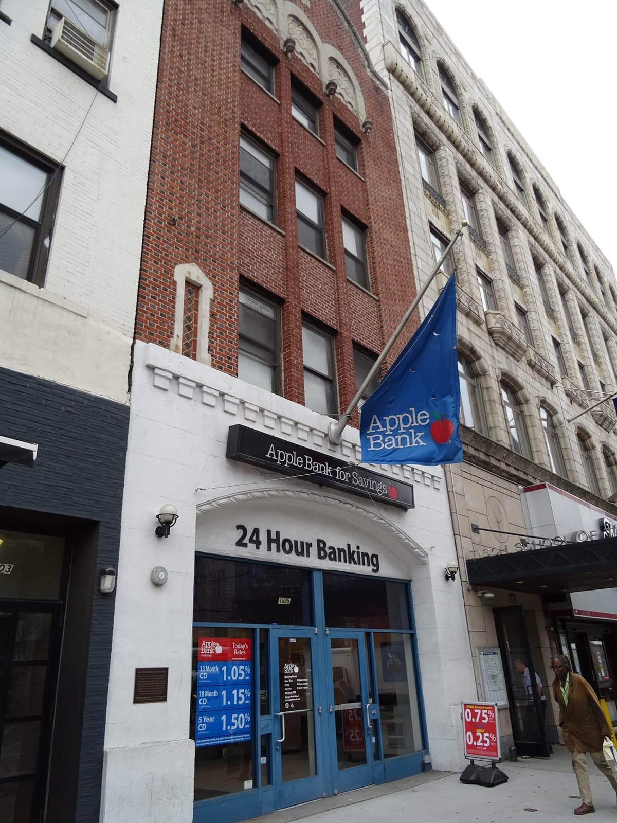 A bank entrance on Second Avenue with a plaque beside the door