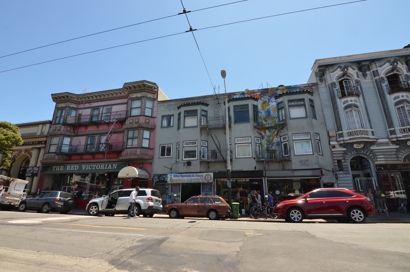 Painted Victorian shopfronts along Haight Street on a sunny day