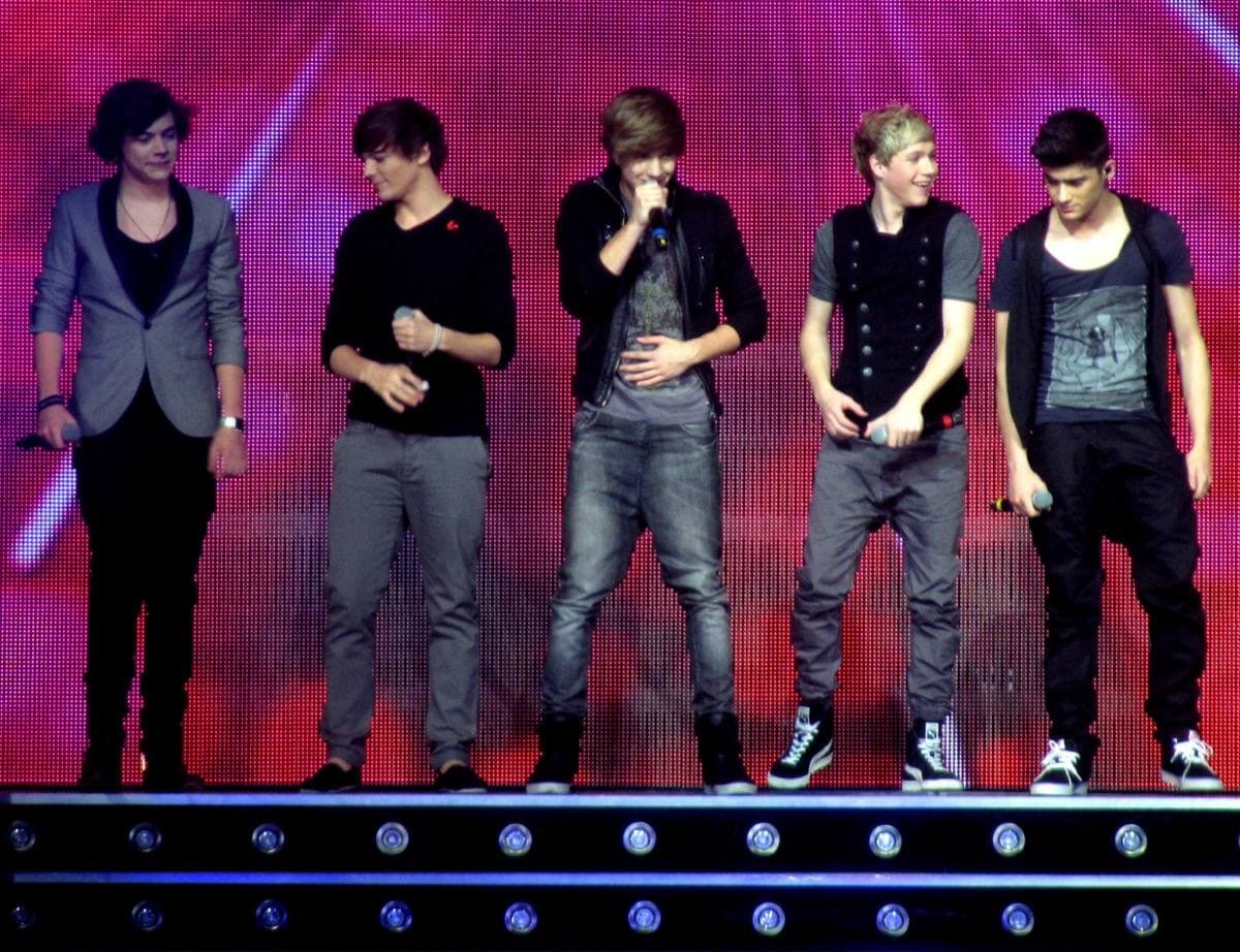 The five members of One Direction on stage in Glasgow in 2011, Harry Styles at the left