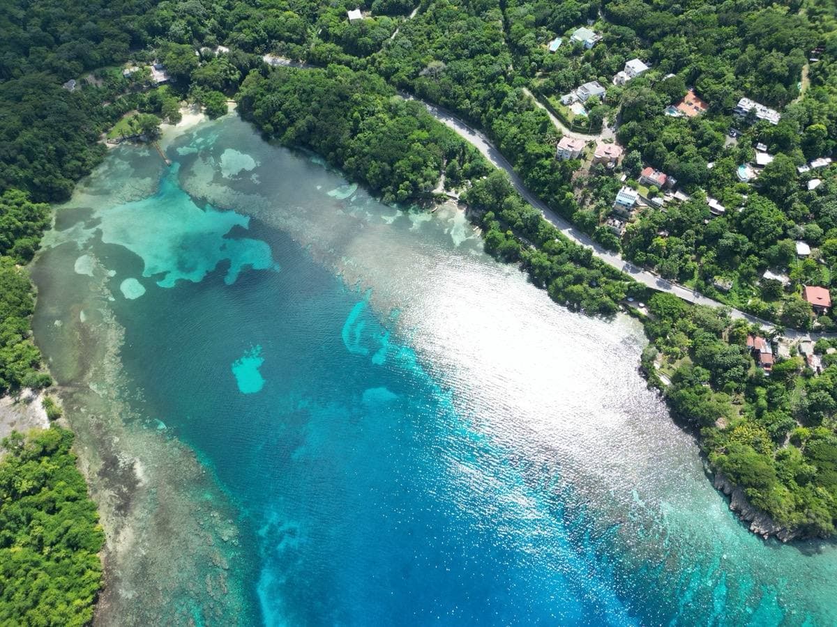 A tropical bay with green hills at San San, Port Antonio