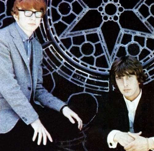 Two young men in a 1960s trade advertisement, one with glasses