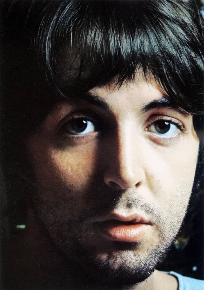 Paul McCartney with a beard, looking at the camera