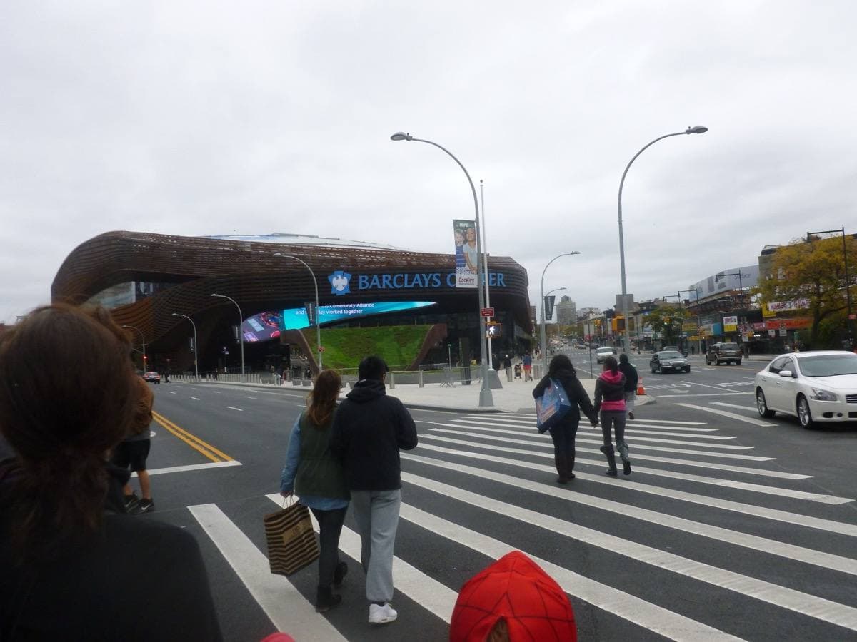 The rust-coloured steel lattice and canopy of Barclays Center
