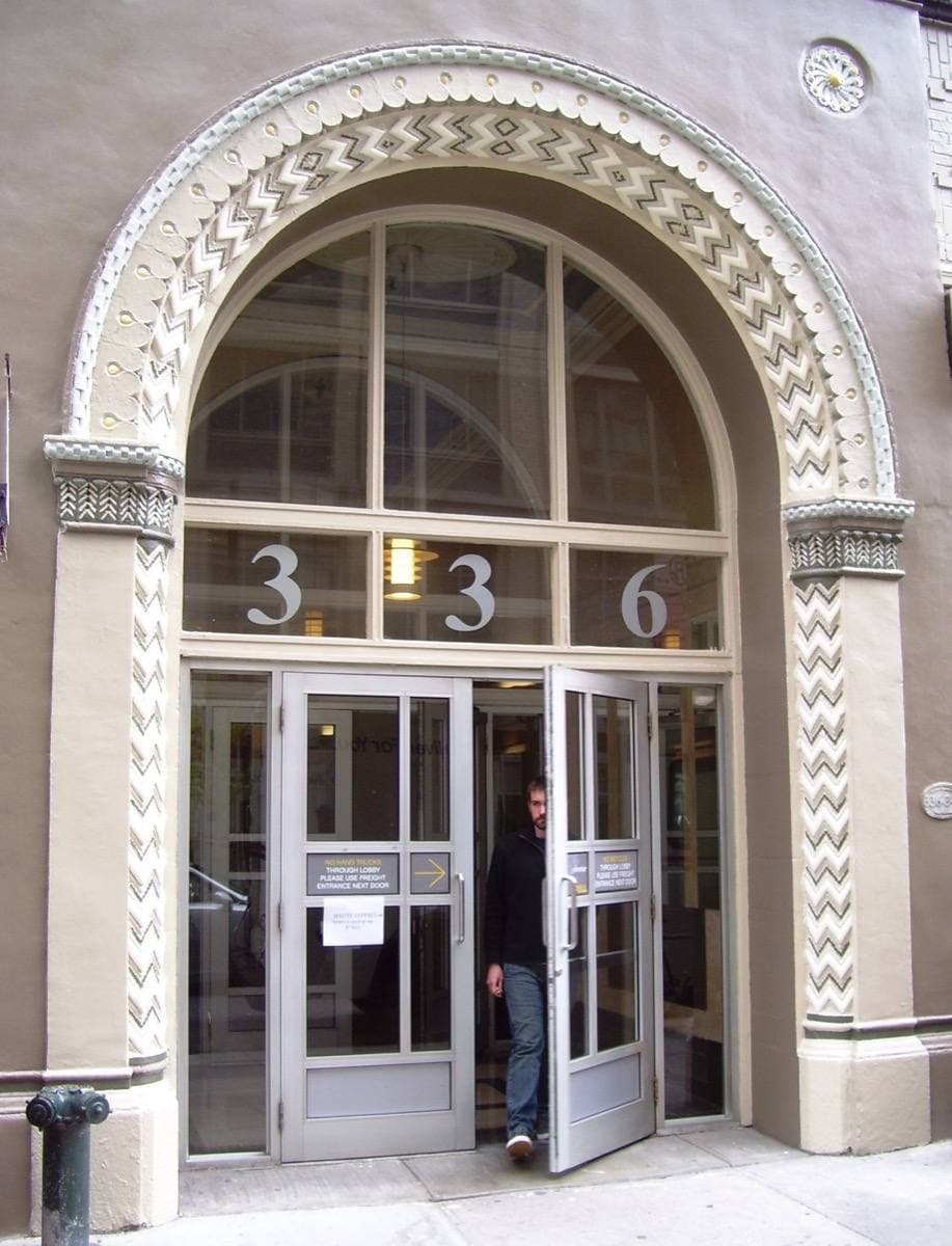 A brick loft building entrance on West 37th Street