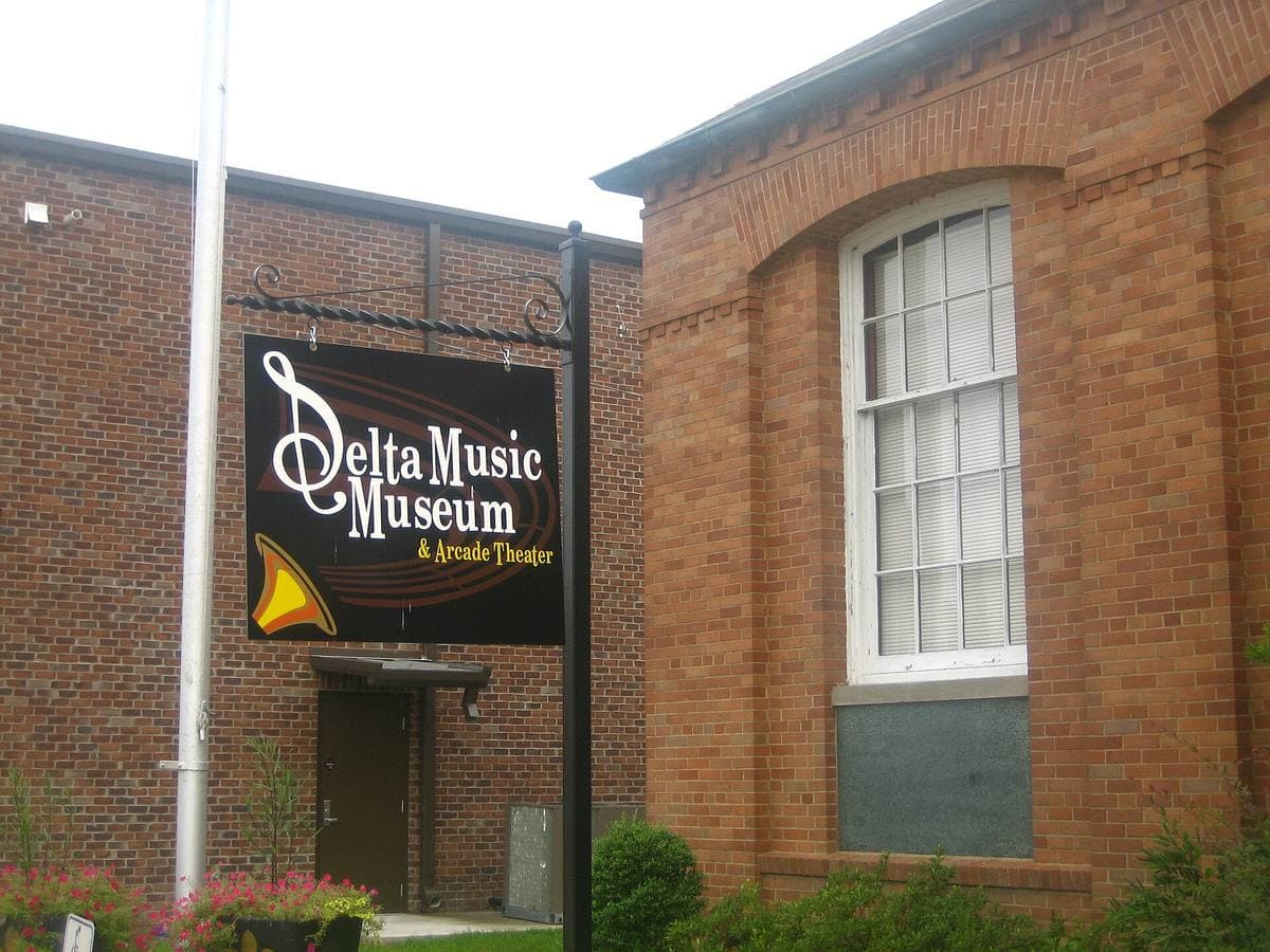 A red-brick building with a Delta Music Museum sign