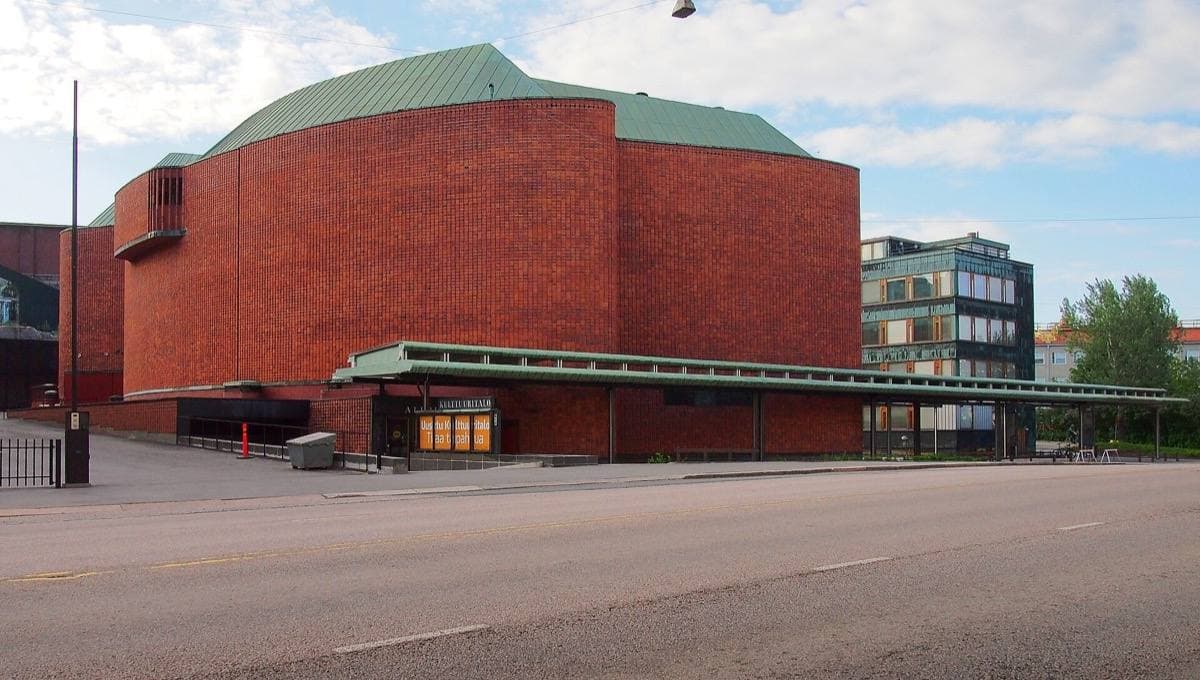 A curved red-brick concert hall
