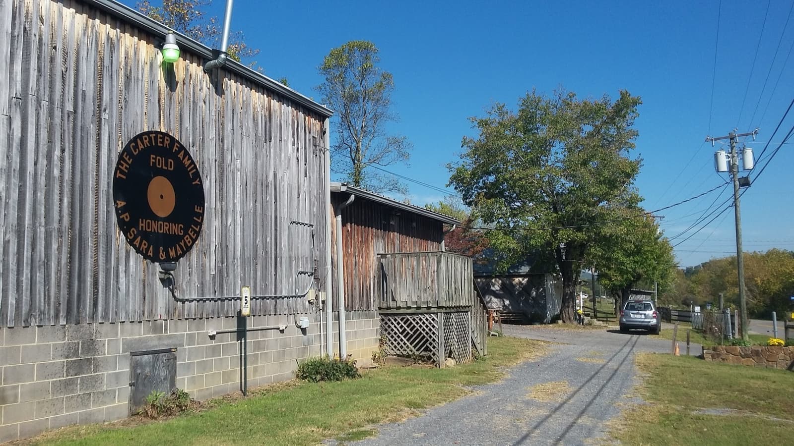 A long wooden music hall on a hillside
