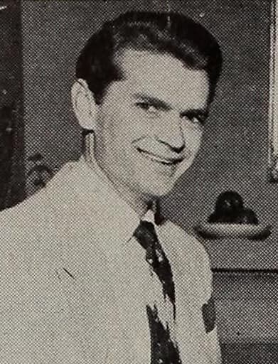 Sam Phillips in a suit and tie