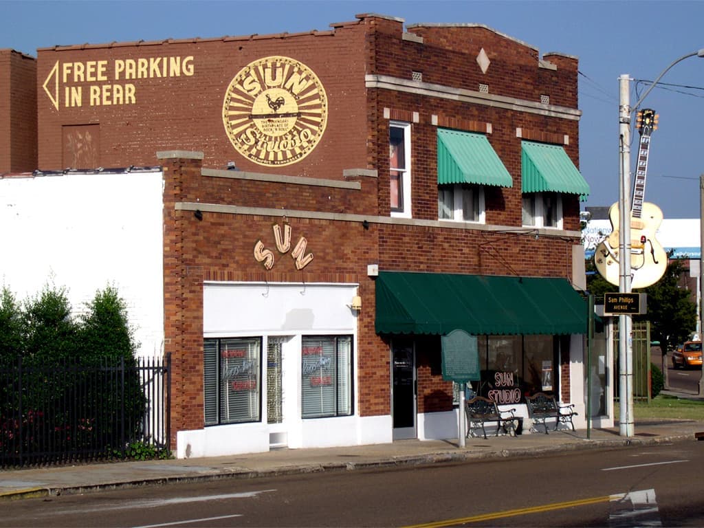 The small corner studio with its sign above the door