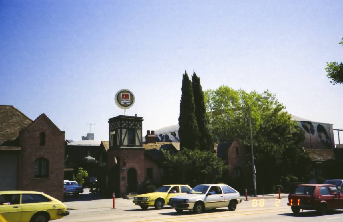 The gated entrance of A&M Studios, with half-timbered buildings behind