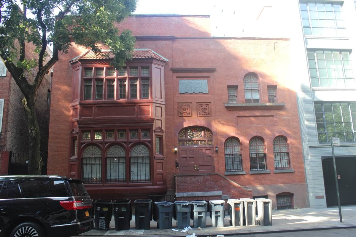 Brick buildings and trees along a Chelsea side street