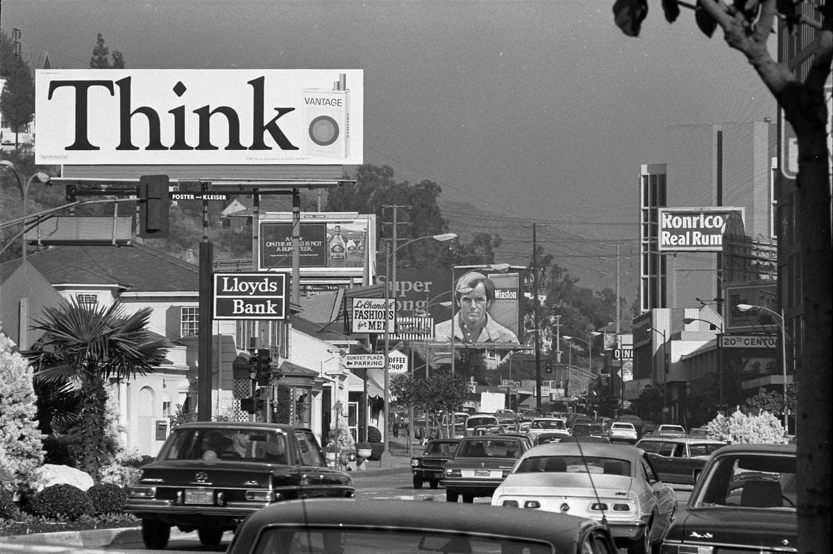 Rock billboards and evening traffic along the Sunset Strip in 1975