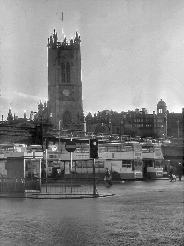 A 1970s bus station with concrete shelters and double-deckers
