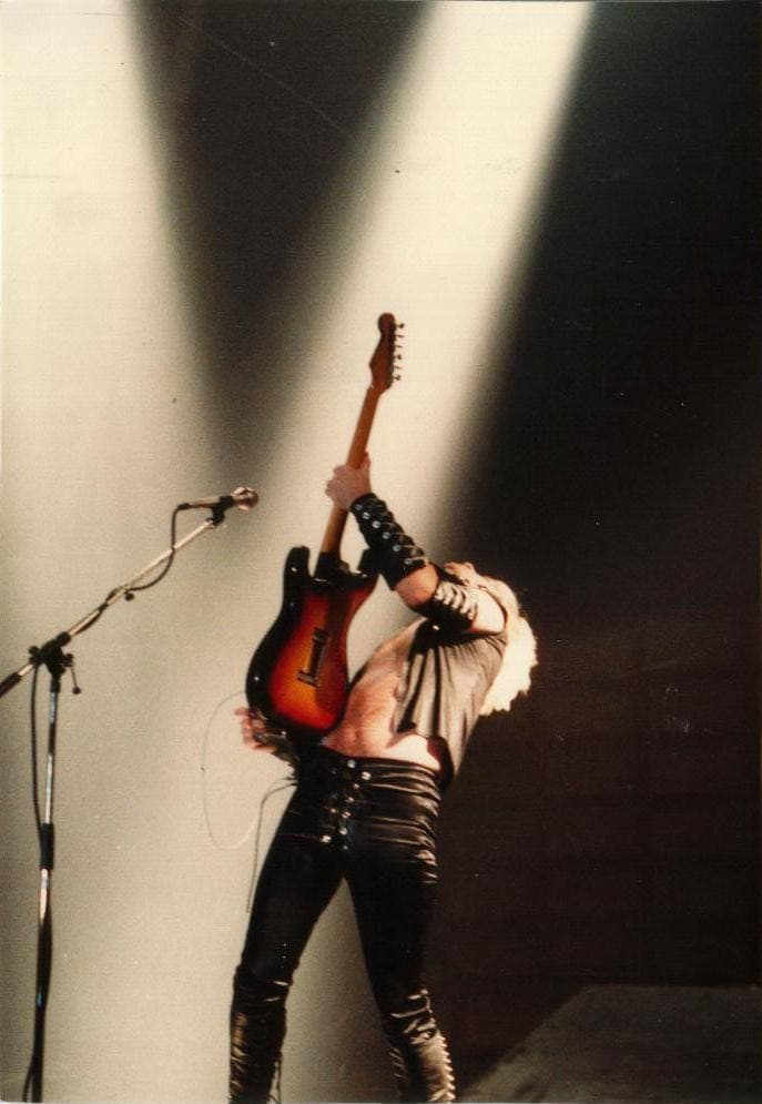 K. K. Downing playing guitar on stage in 1980