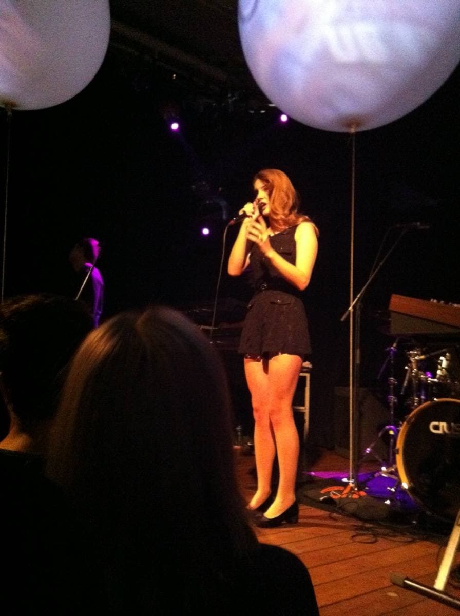 Lana Del Rey on stage, singing