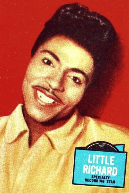 Little Richard smiling, his hair in a high pompadour, in a 1957 colour portrait
