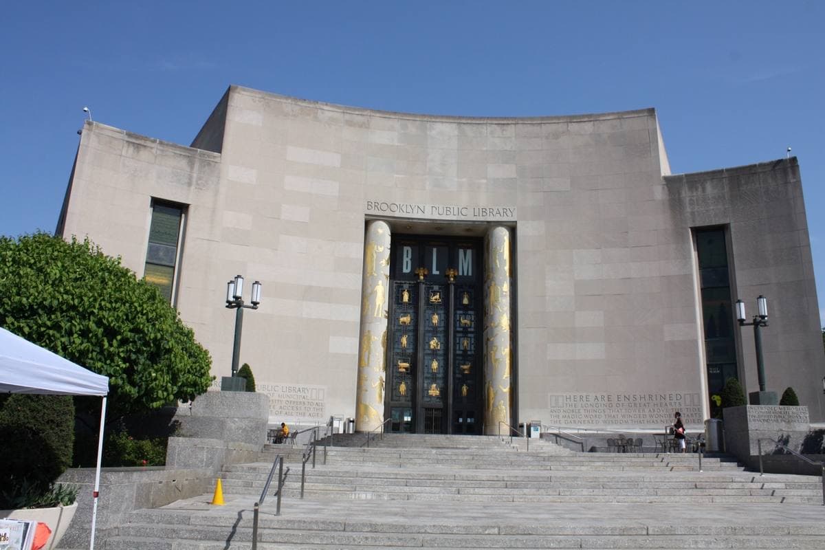 The tall pale stone front of the Central Library with long vertical windows