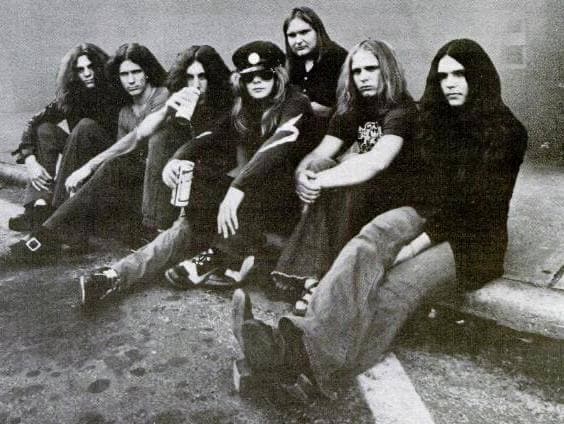 The early band, long-haired, in a 1973 group photograph