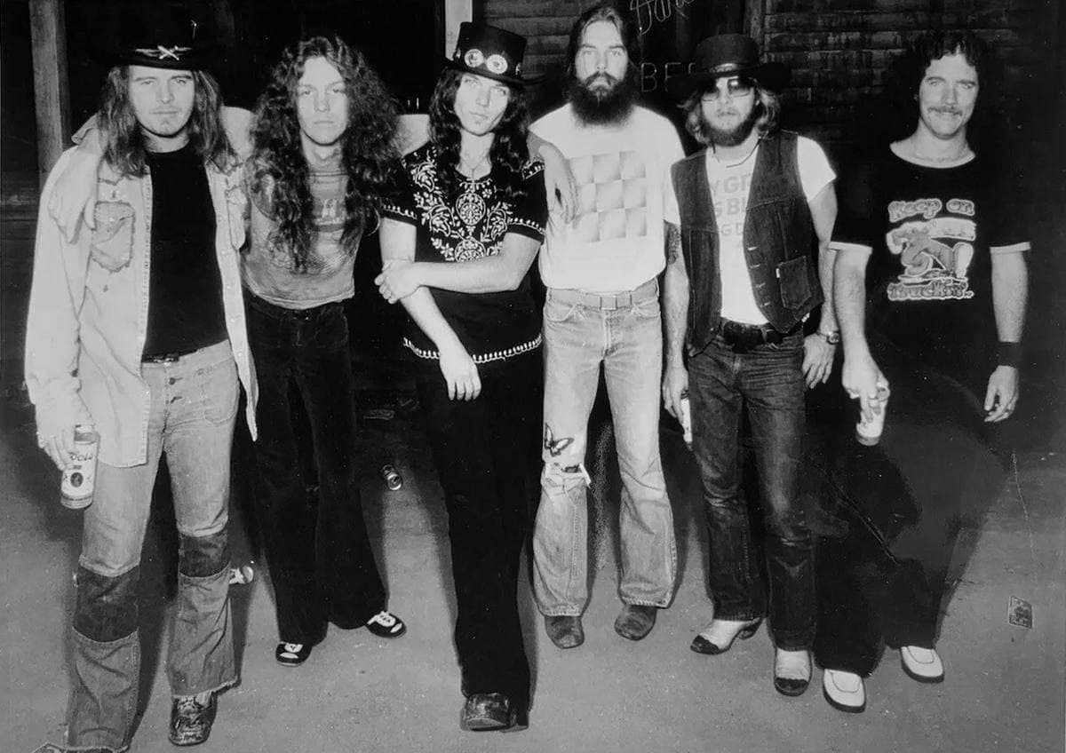 The seven men of Lynyrd Skynyrd in 1976, long-haired, posed together