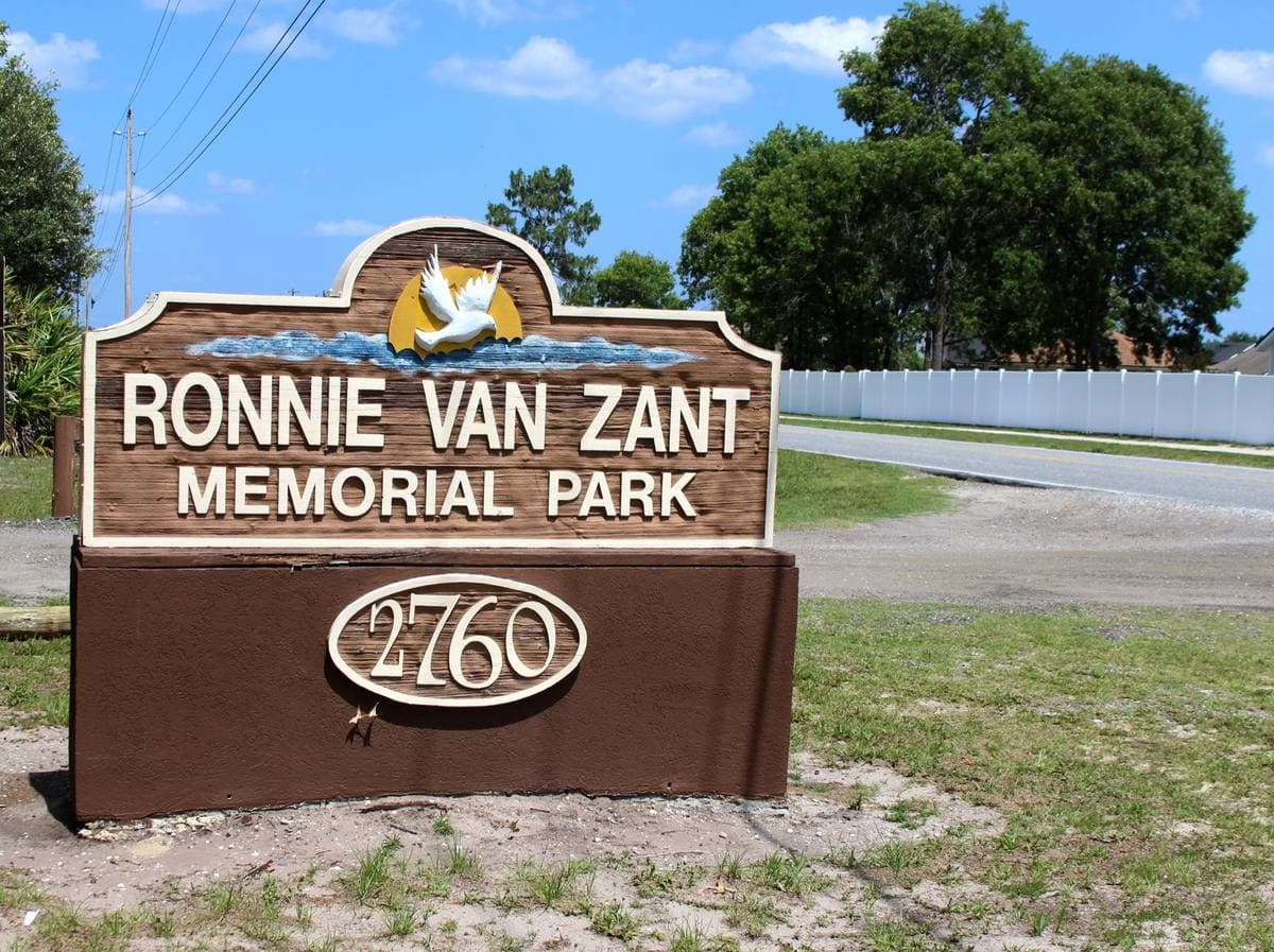 A park sign among trees