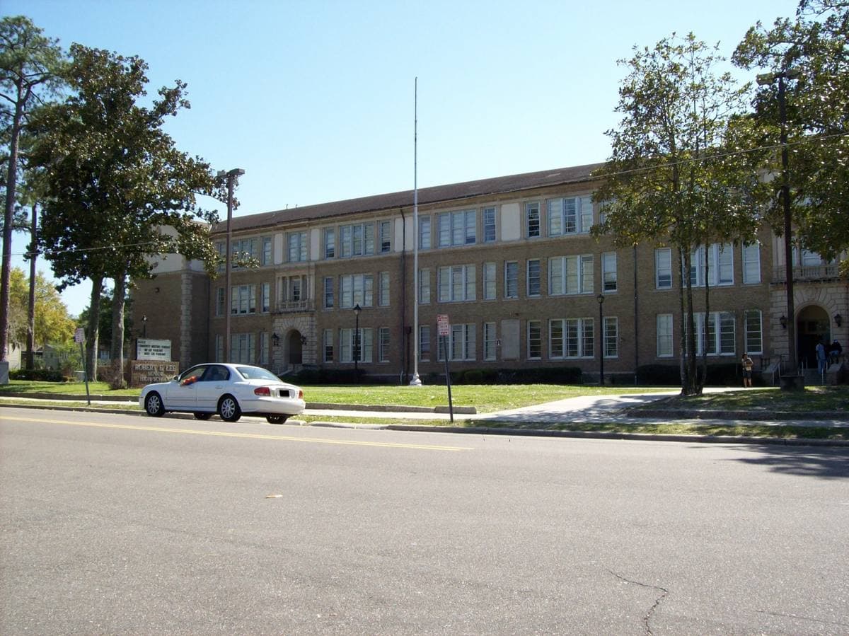 A brick high-school front with a columned entrance