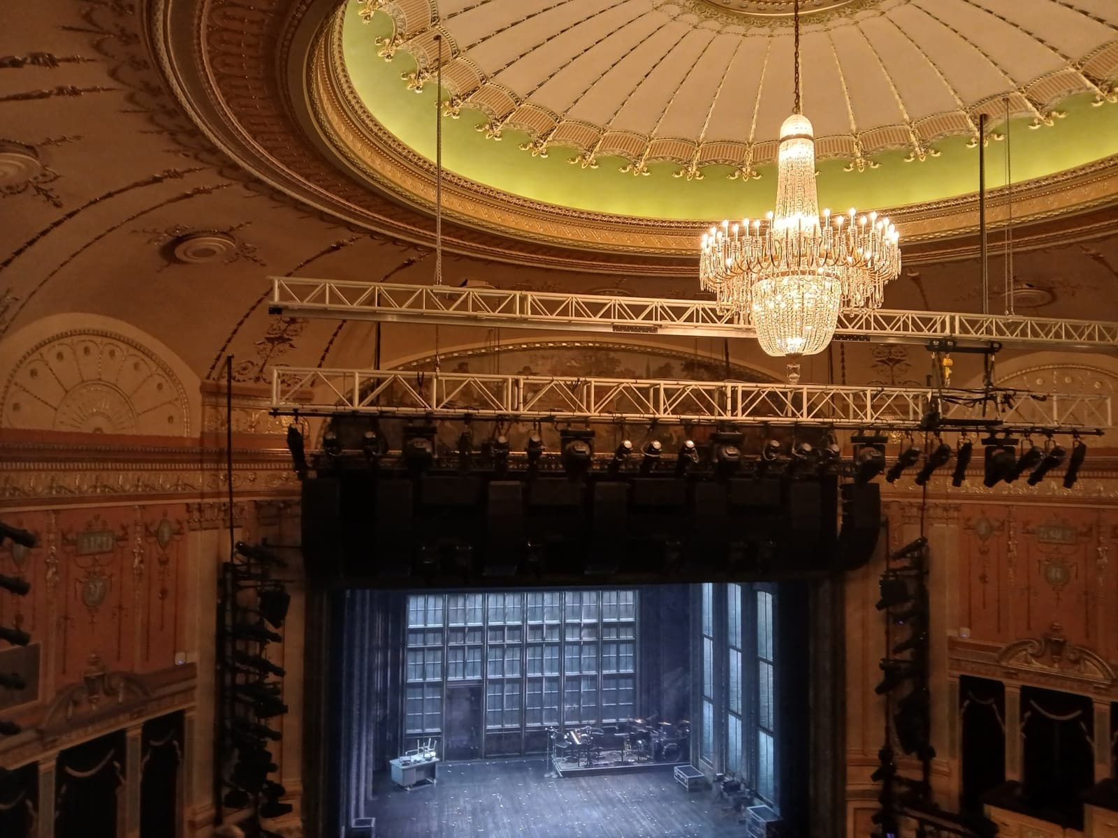 The gilded auditorium of a Broadway theatre seen from the seats