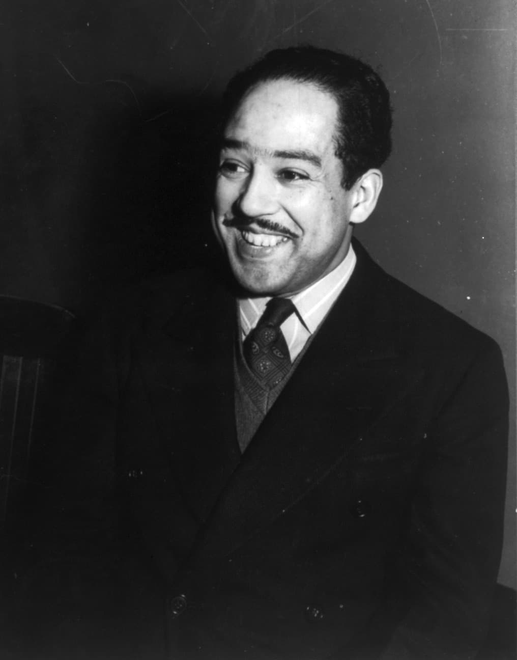 Half-length portrait of Langston Hughes facing left