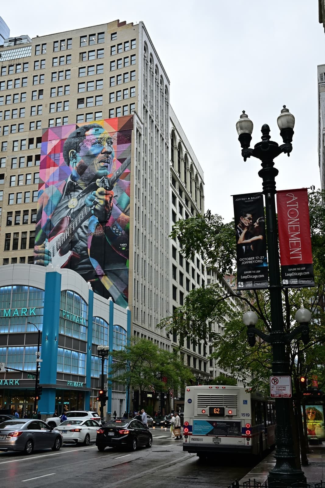 A ten-storey multicoloured portrait of Muddy Waters on the side of a Loop building