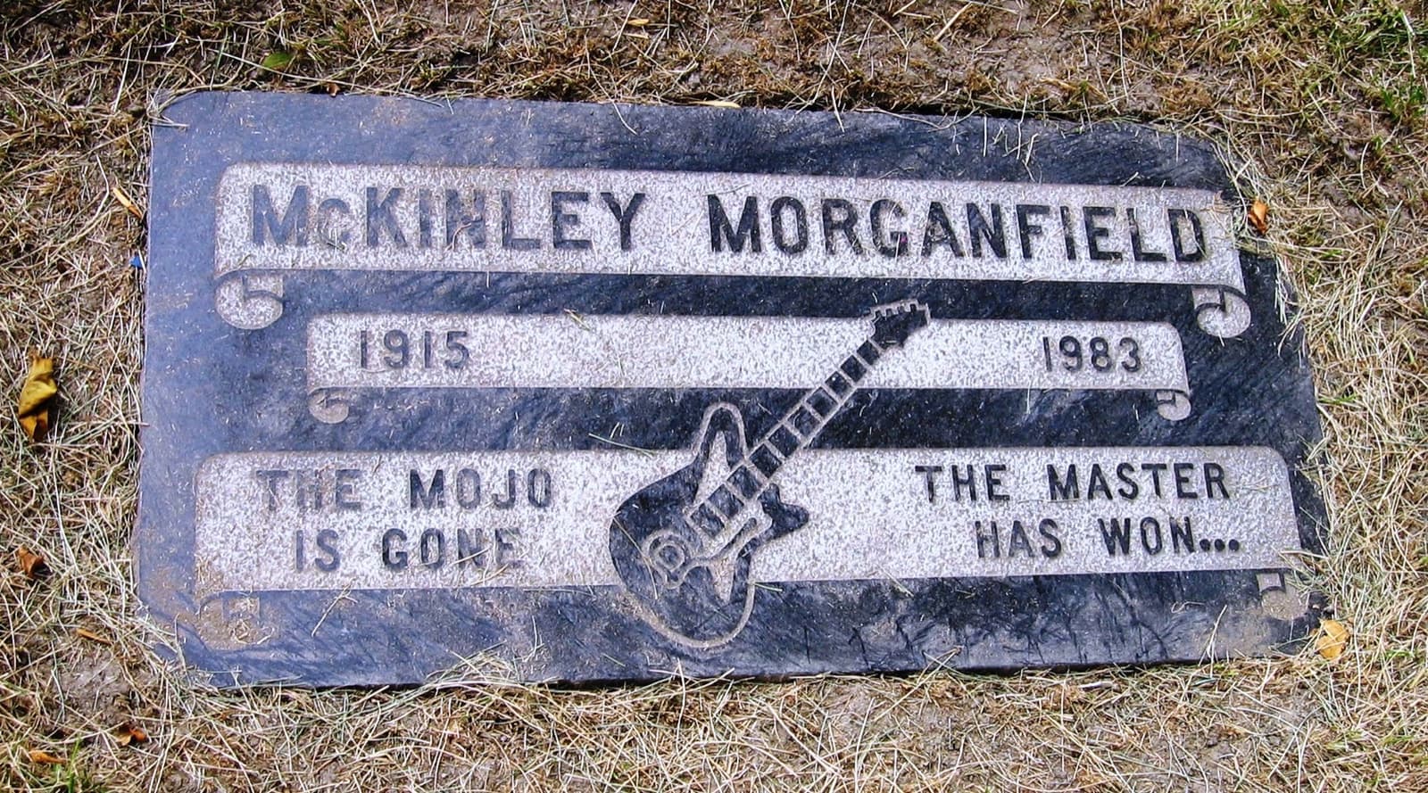 Muddy Waters’s gravestone with flowers at Restvale Cemetery