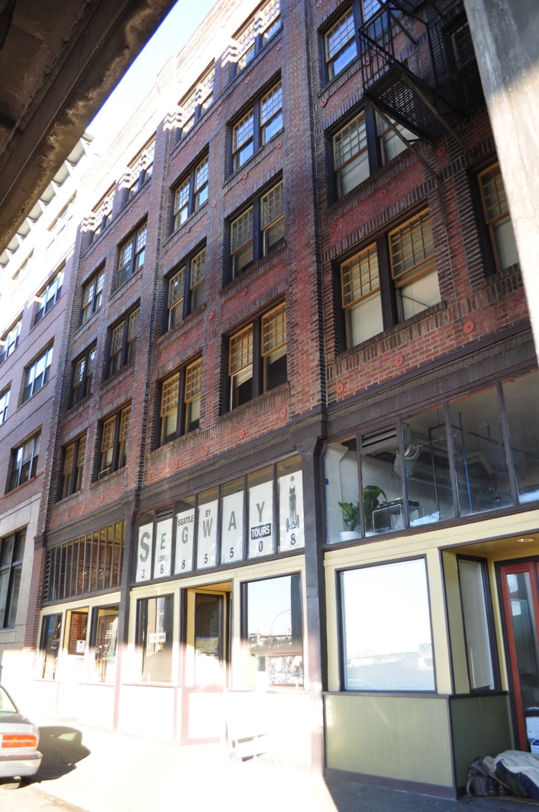 A brick building with the painted name OK Hotel near the Seattle waterfront