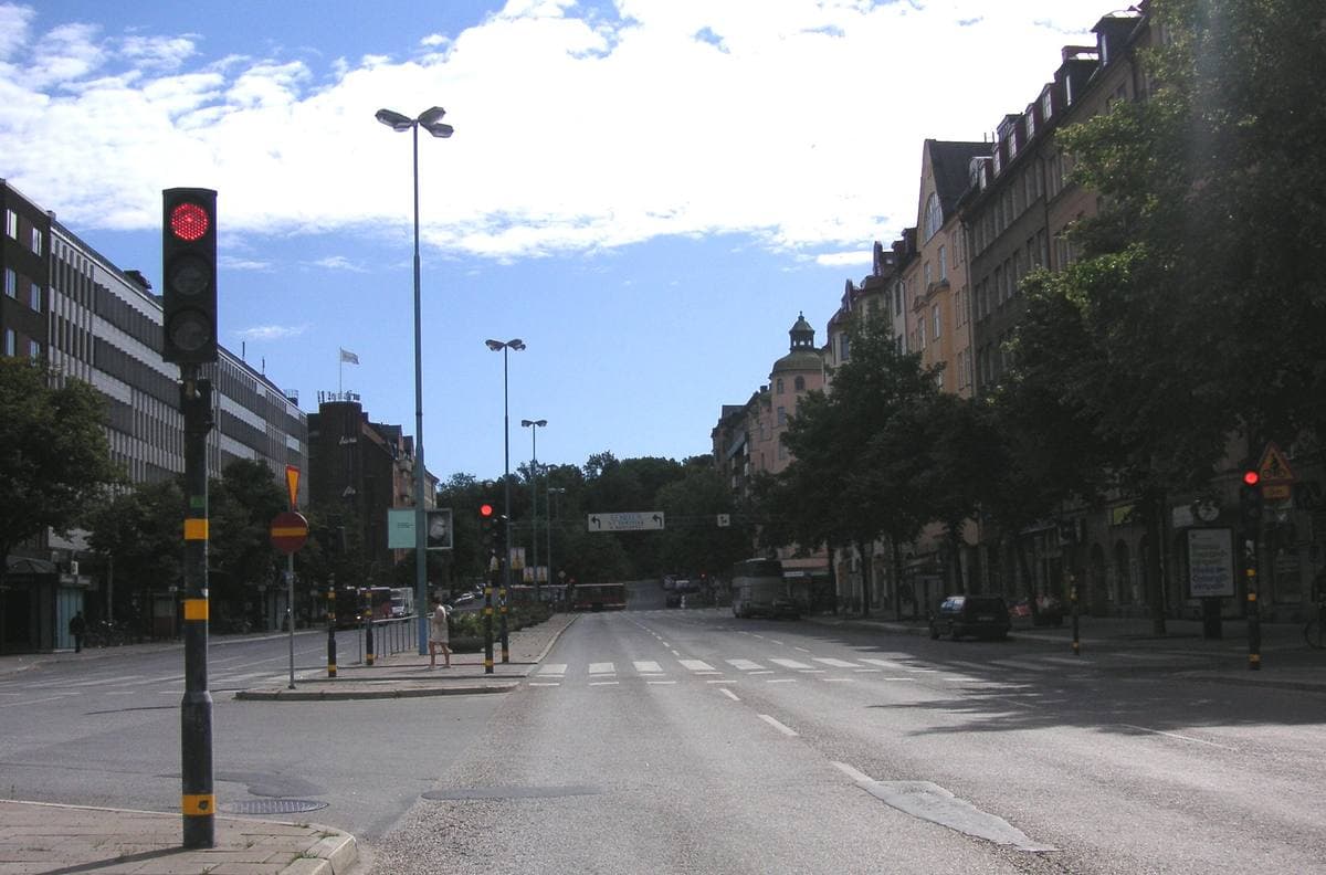 A busy Stockholm square with buses and tall apartment blocks, 2008