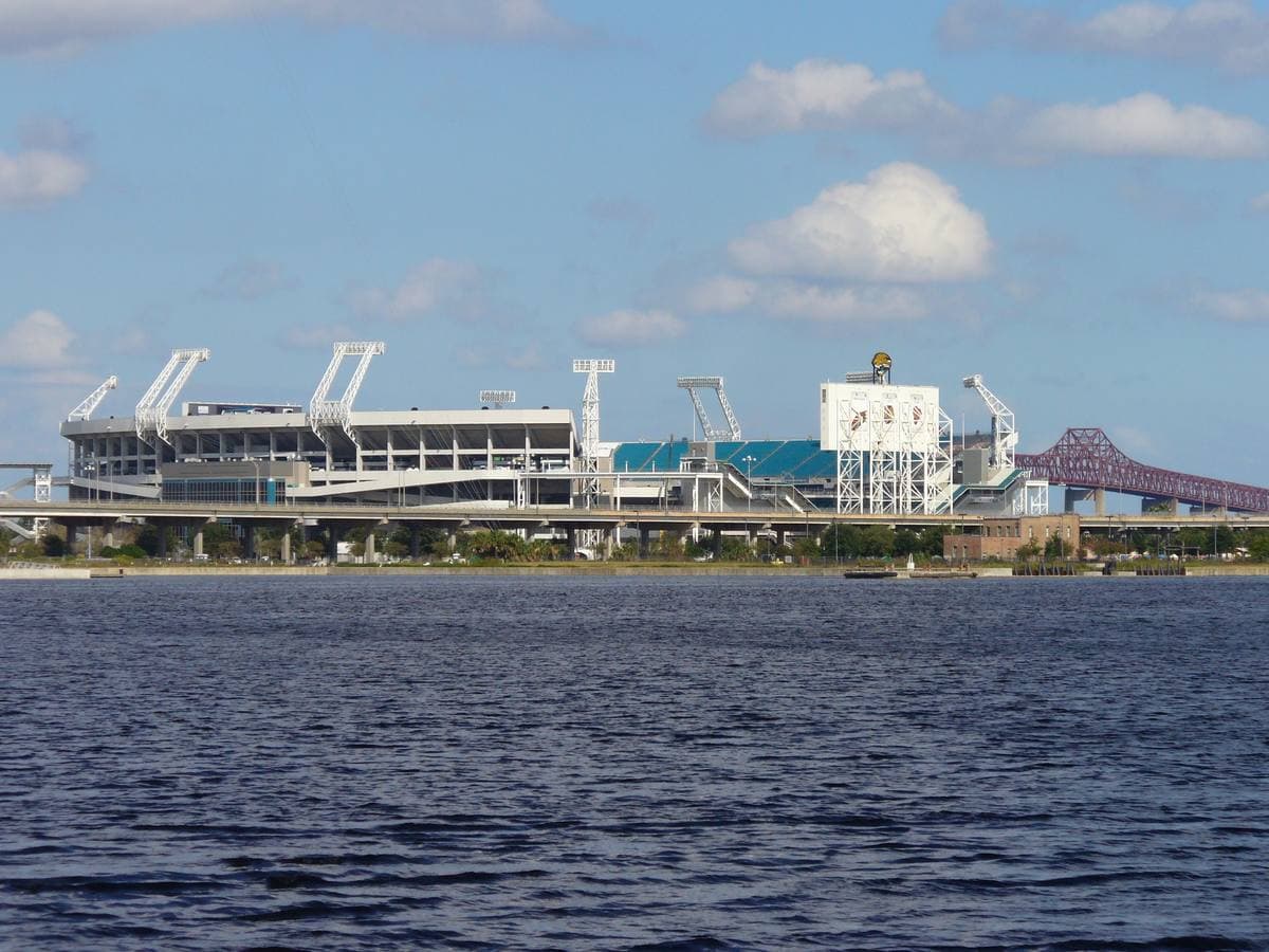 A football stadium across a wide river