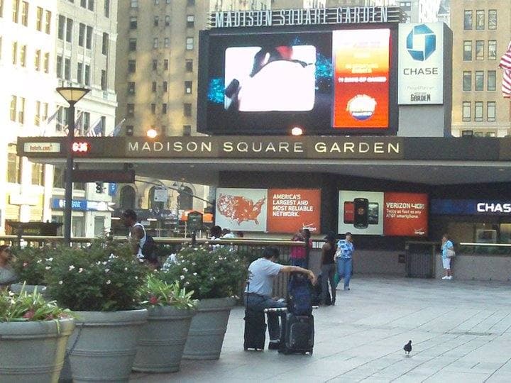 The round drum of Madison Square Garden above a street entrance