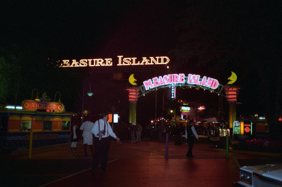 A waterfront entertainment district with club buildings and signs, 1995
