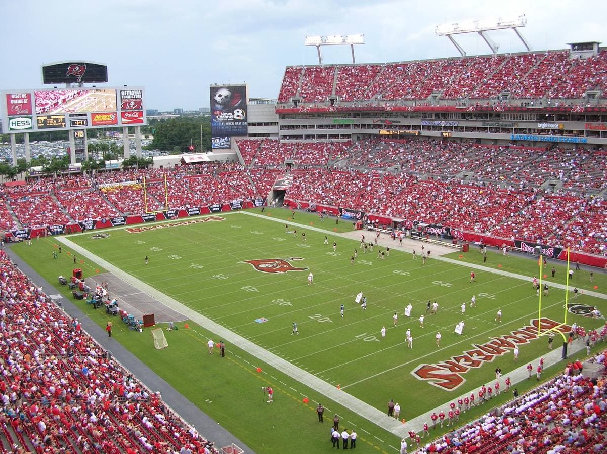 The stands and pitch of a large American football stadium