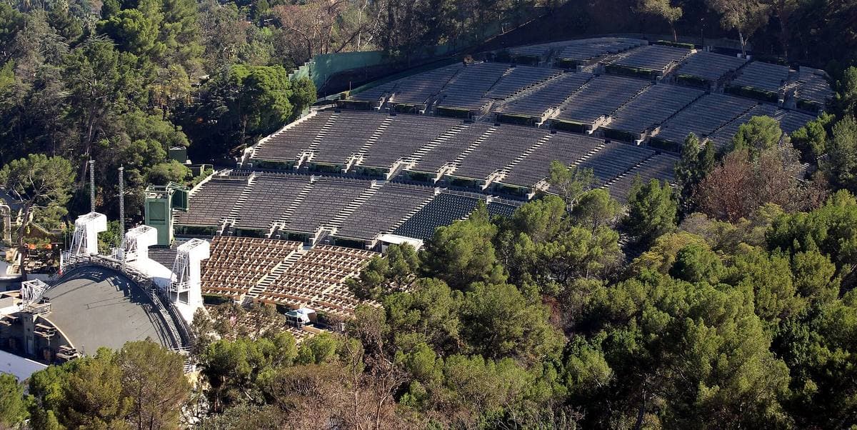 The Hollywood Bowl’s white shell and curved rows of seats set into a wooded hillside