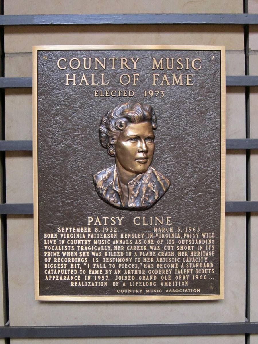 A bronze plaque with a relief portrait of Patsy Cline under the words Country Music Hall of Fame