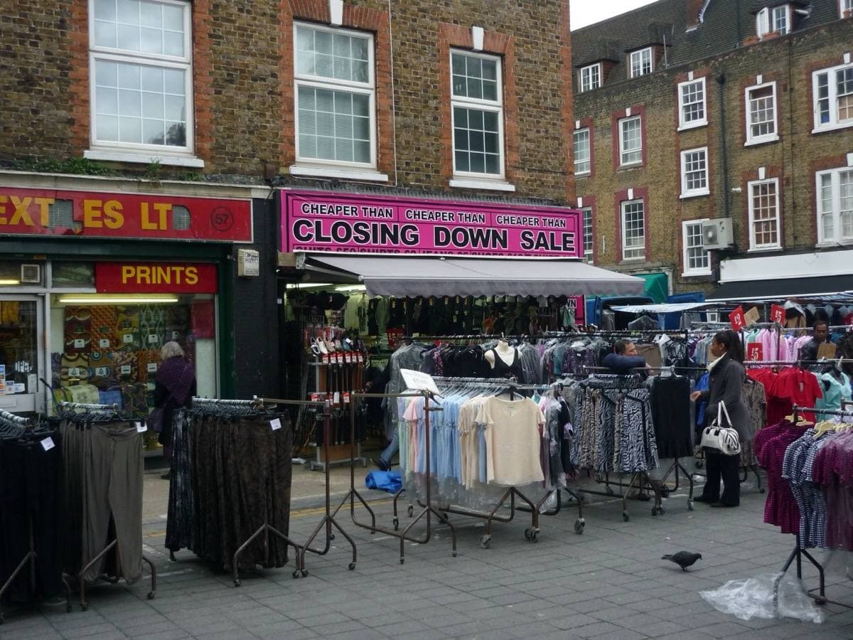 Clothes rails and shopfronts at the Wentworth Street market