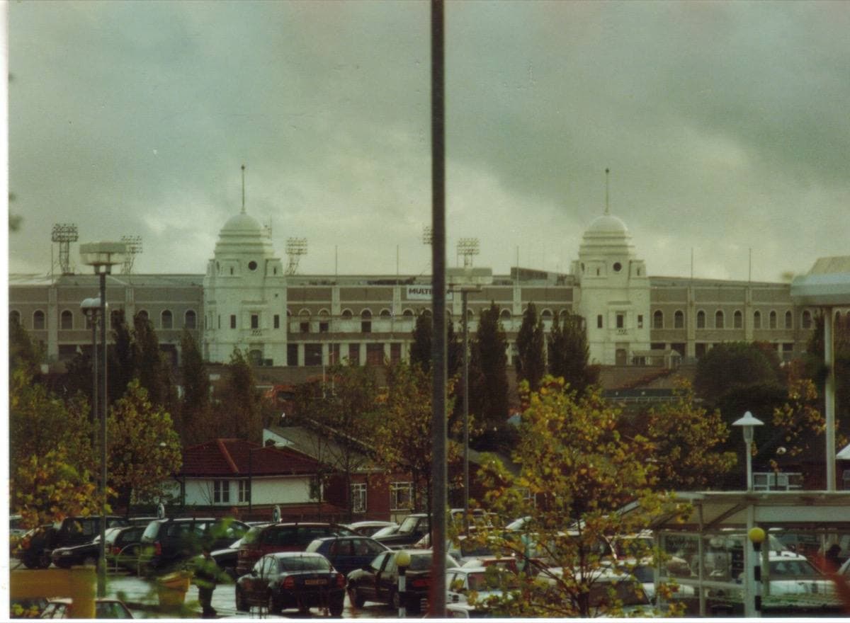 The white twin towers of the old Wembley Stadium behind a car park