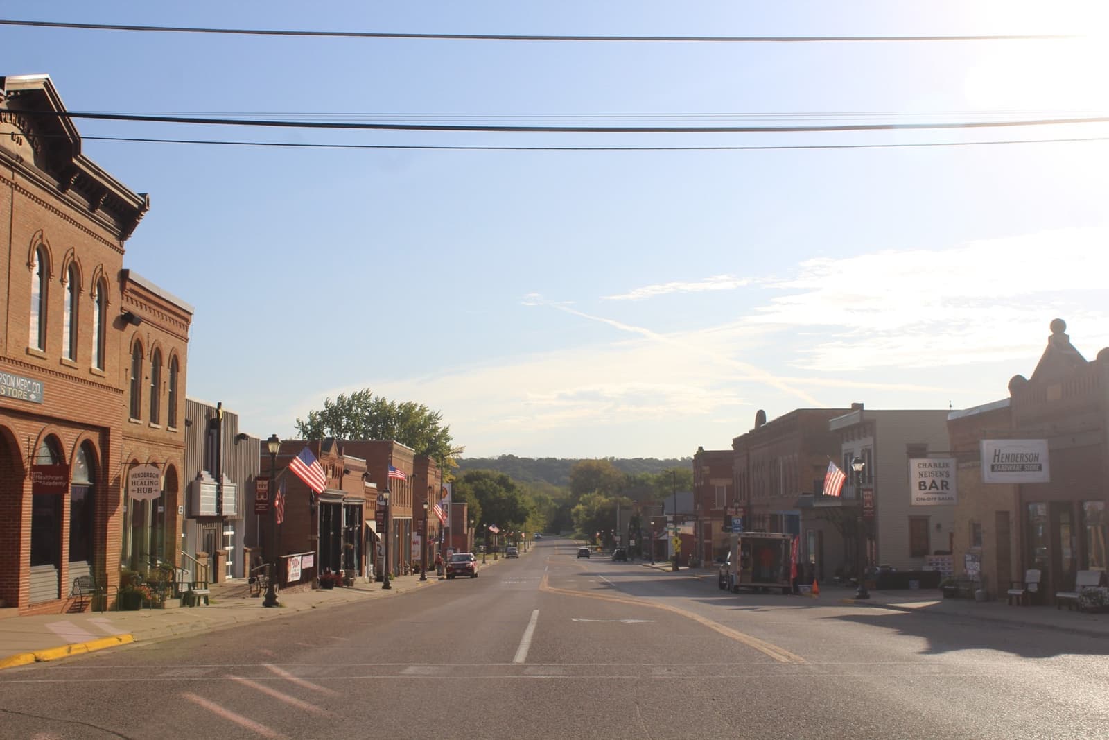 A quiet main street of old brick shopfronts
