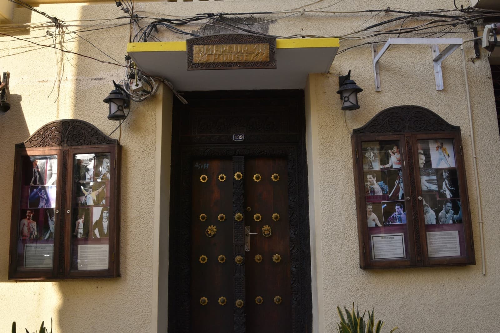 A whitewashed house with a carved door in Stone Town
