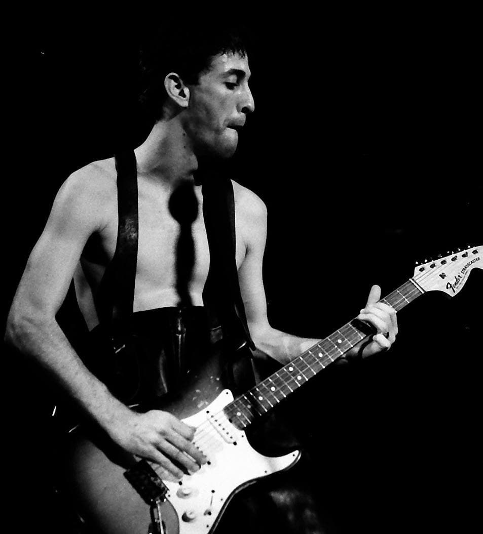 Hillel Slovak on stage with an electric guitar, 1983