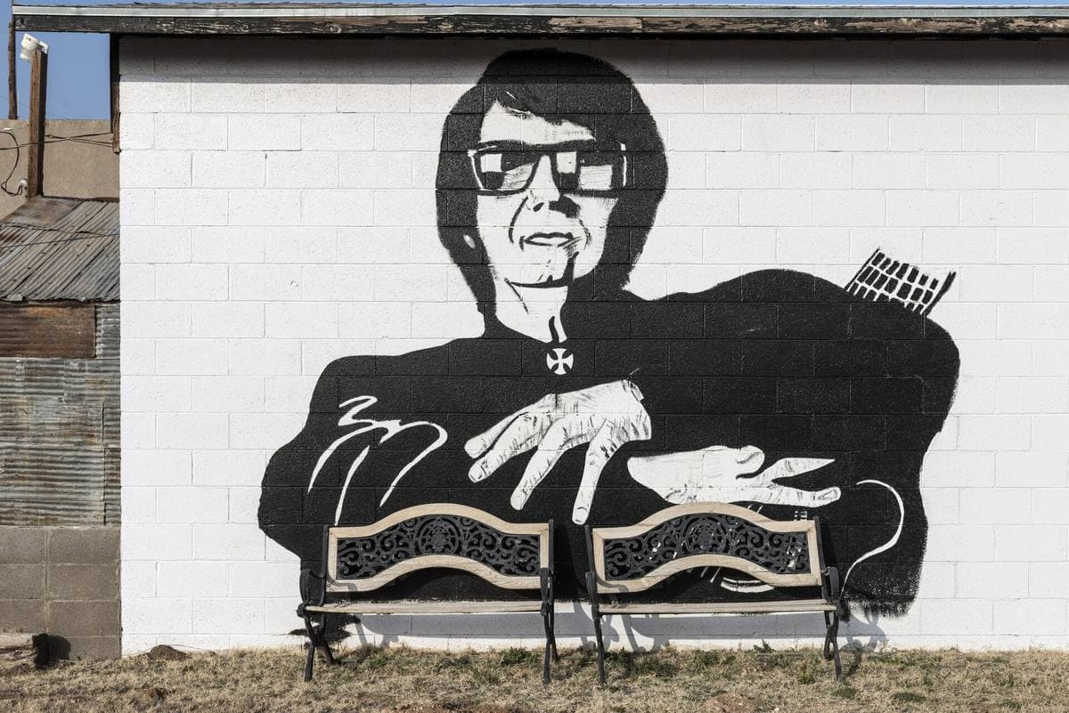 A painted portrait of Orbison on a museum wall
