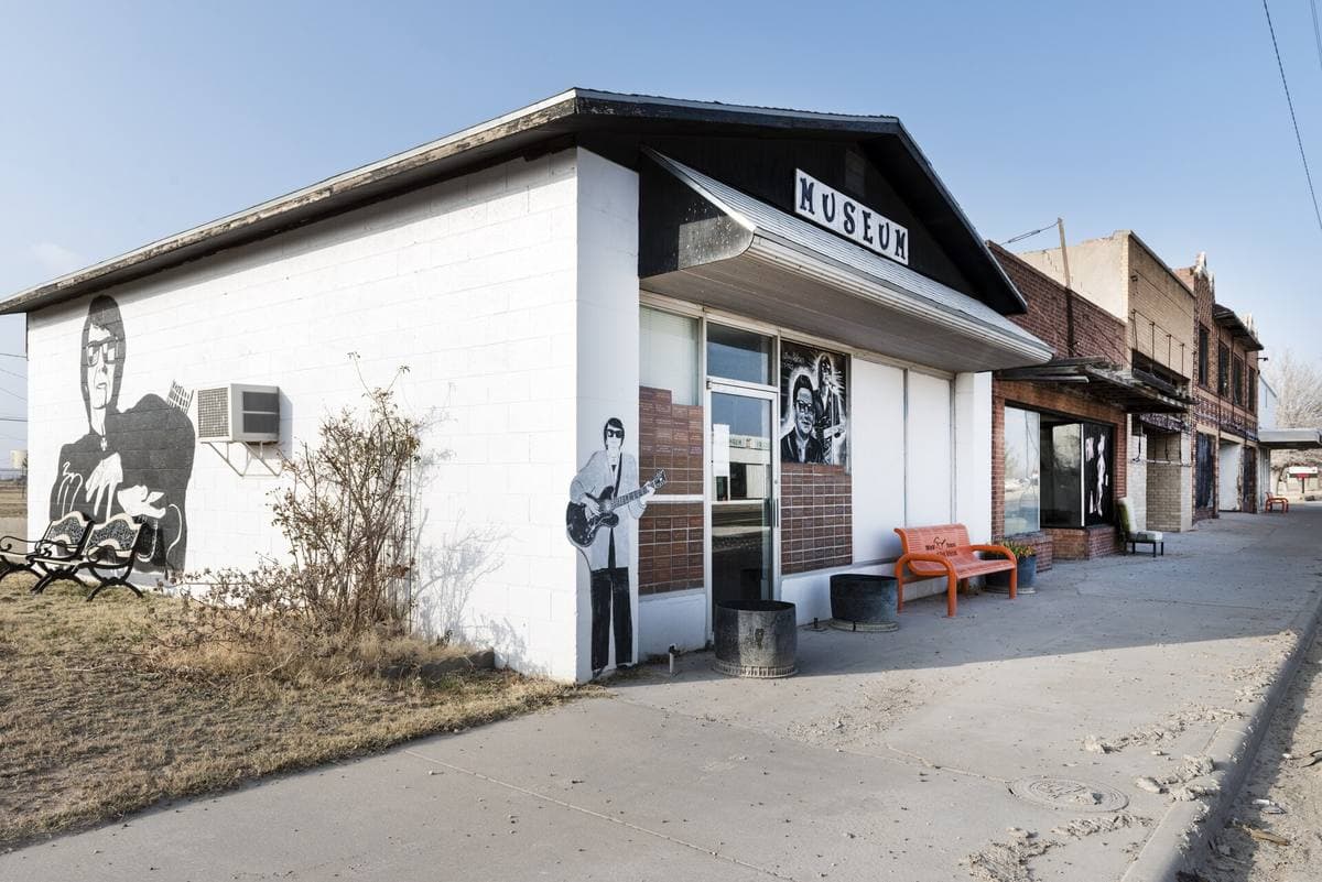 A small white storefront museum with Orbison painted on its walls