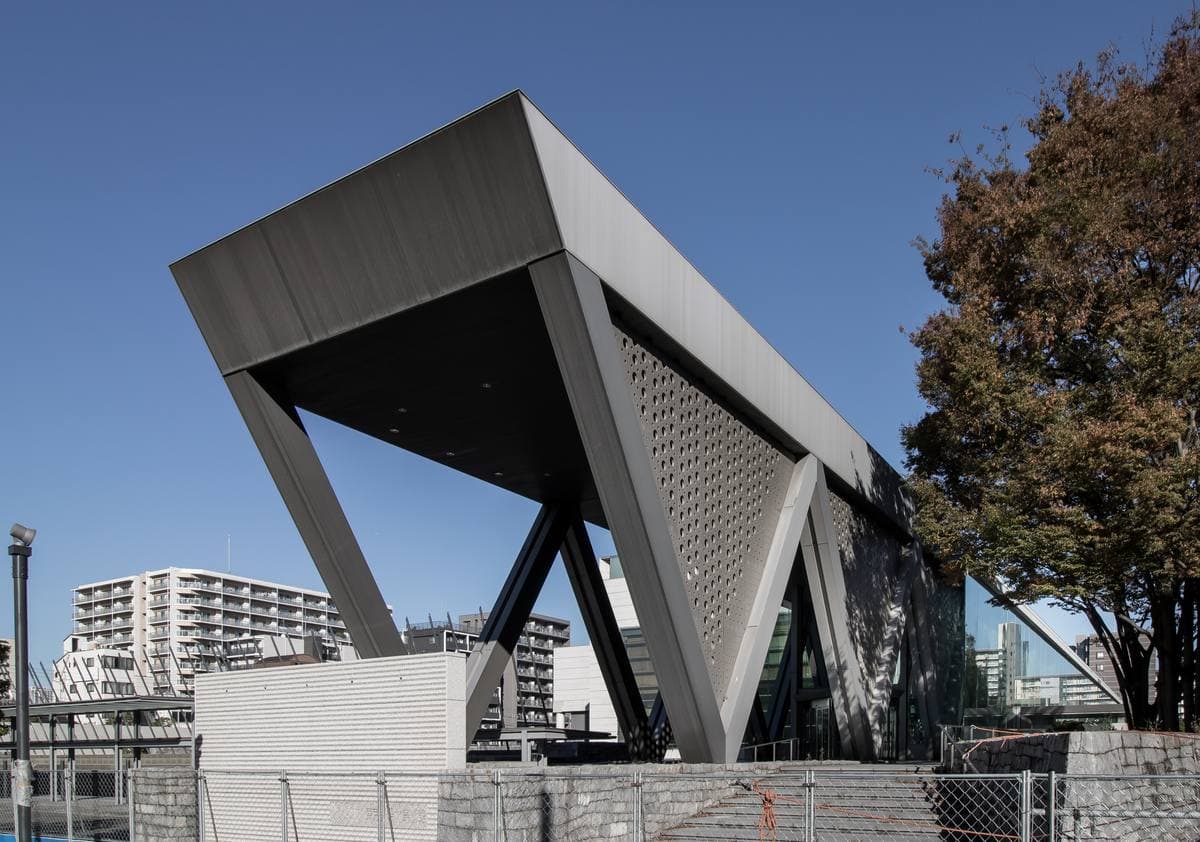A long low museum building of glass and steel