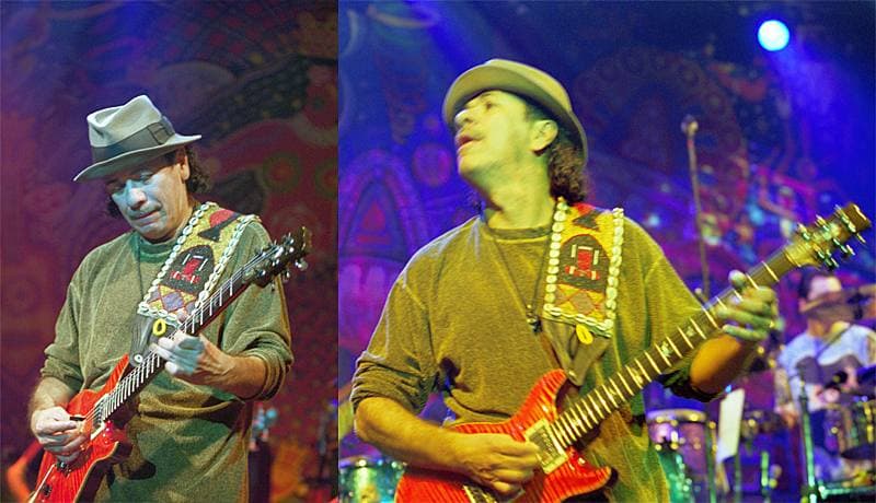 Carlos Santana playing guitar on stage in 2000