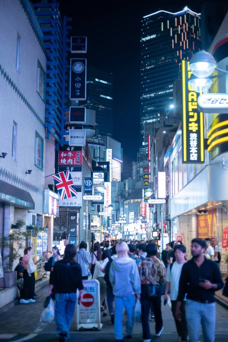 Center-gai at night, crowds walking under lit signs