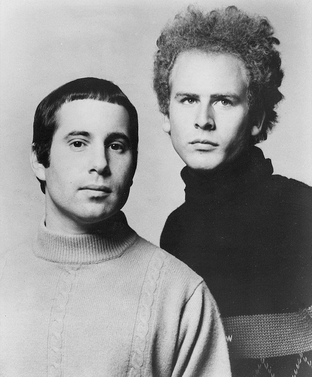 Simon & Garfunkel: Bookends: twelve places shelved as volumes between two 1968 portrait bookends; pull one to open it, take a bookend away and the shelf slumps until 1981; carry the Boxer horns into St Paul’s Chapel to light its vault; wait on the Queens-bound platform for a clean cover frame.
