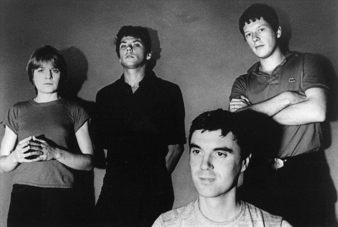 The four members of Talking Heads in a black-and-white group portrait