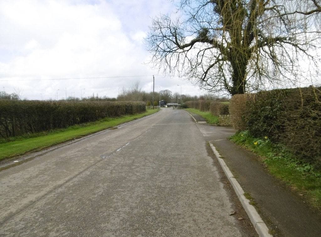 A stone-built village street in Beckington, Somerset